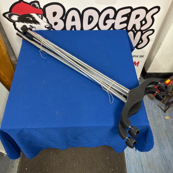 Silver metal wheeled clothes rail for garment storage.