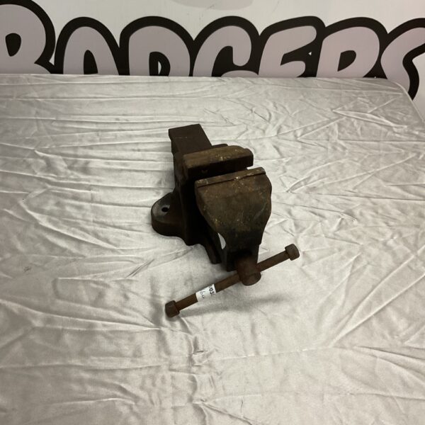 Vintage Woden bench vice for metalworking and workshop use.