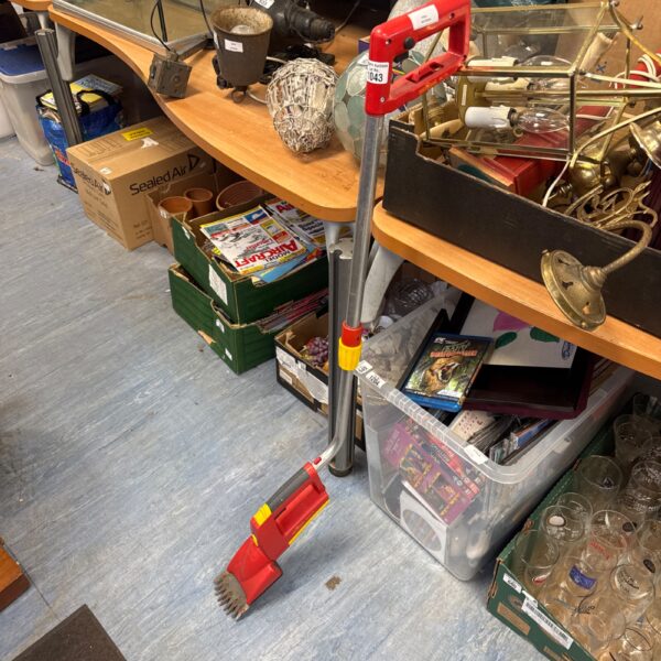 Used Wolf Garten cordless lawn edger for garden maintenance.