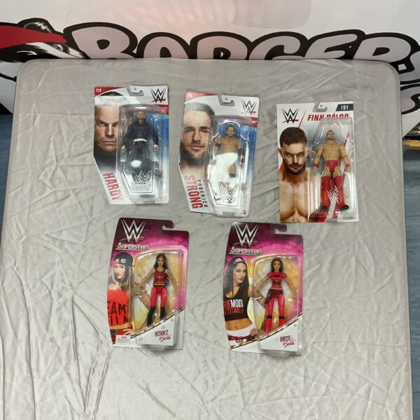 WWE action figures lot featuring Jeff Hardy, Finn Balor, and others.