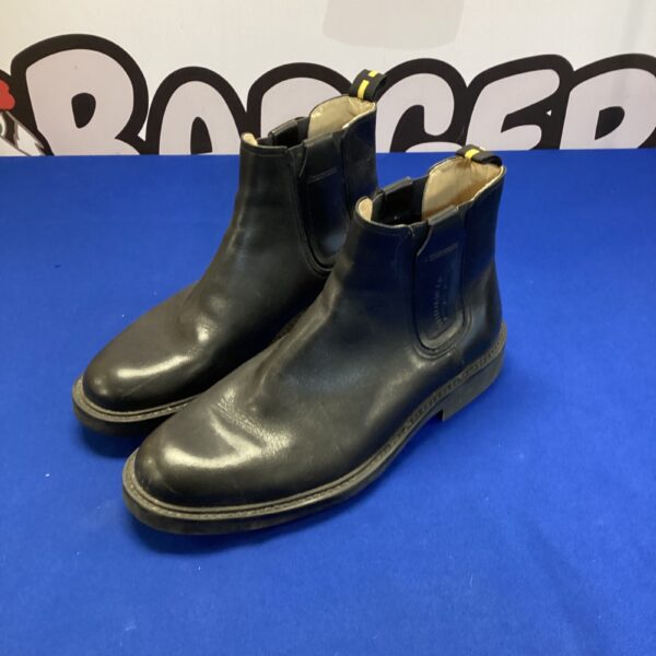 Vintage Yellomiles size 9 leather boots, brown and well-worn.