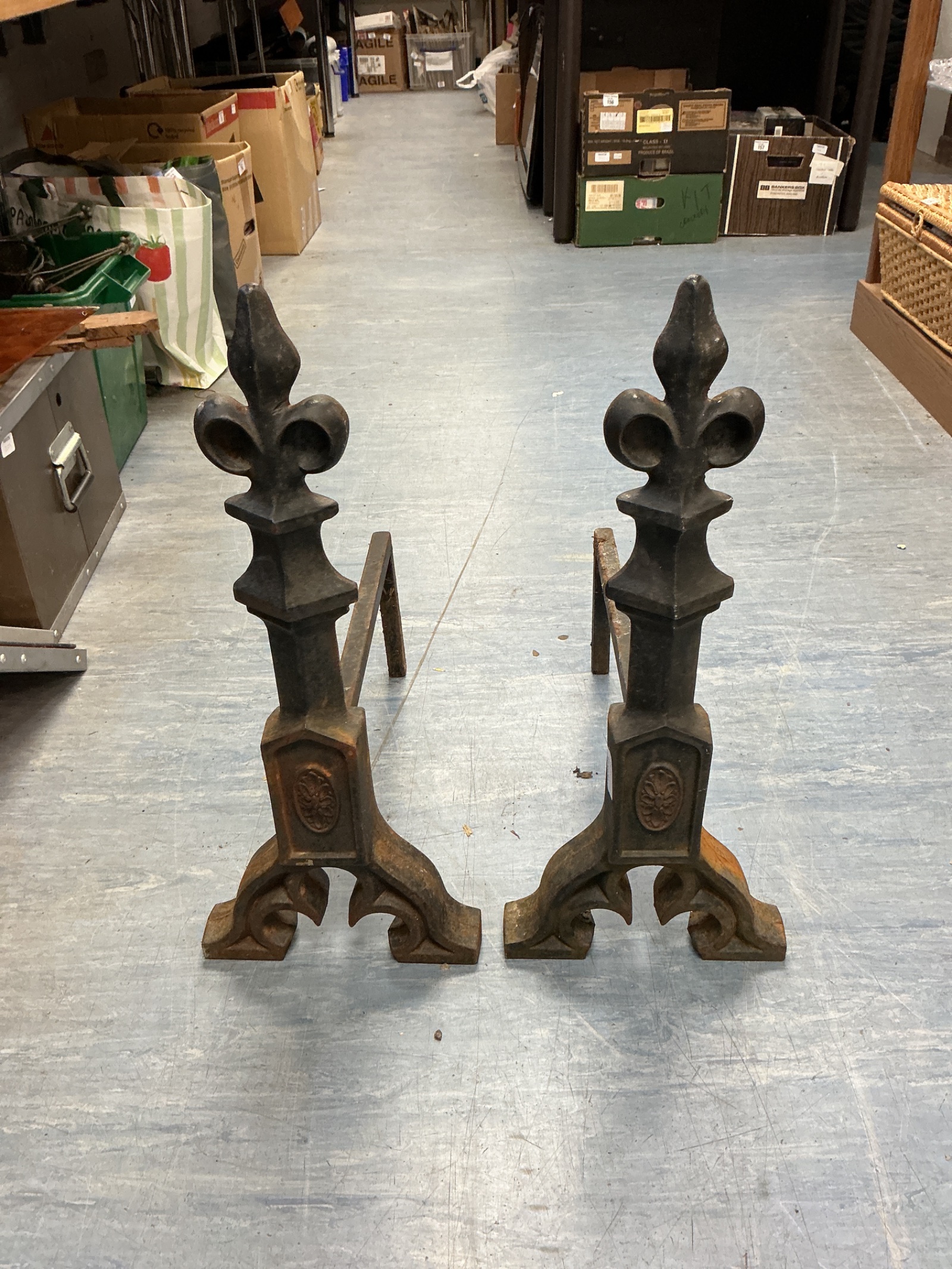 068 Pair of antique cast iron fleur de lis fire dogs
