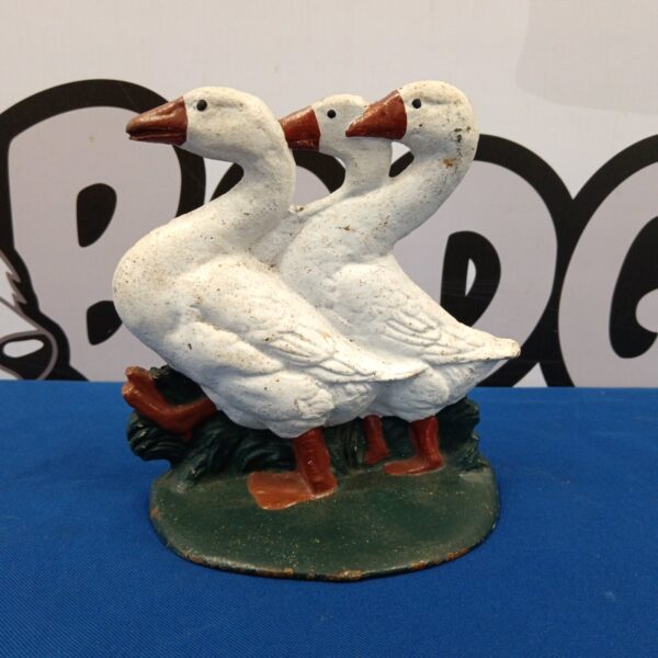 Antique cast iron goose doorstop with detailed feathering.