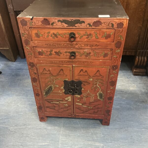 Antique Chinese side cabinet with red lacquer detailing.