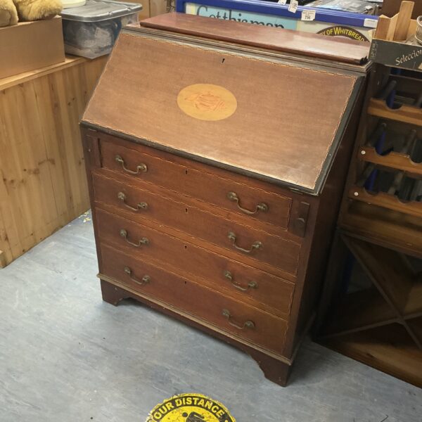 Antique mahogany bureau with drawers, vintage writing desk.