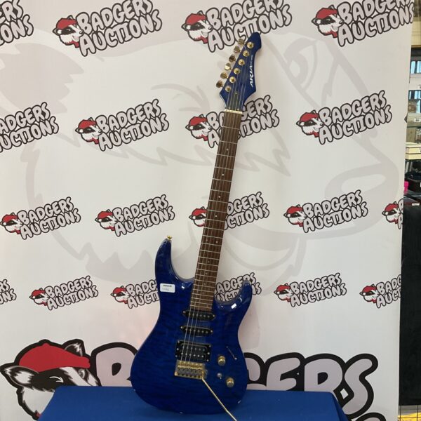 Blue Aria Mac Series electric guitar with tremolo system.