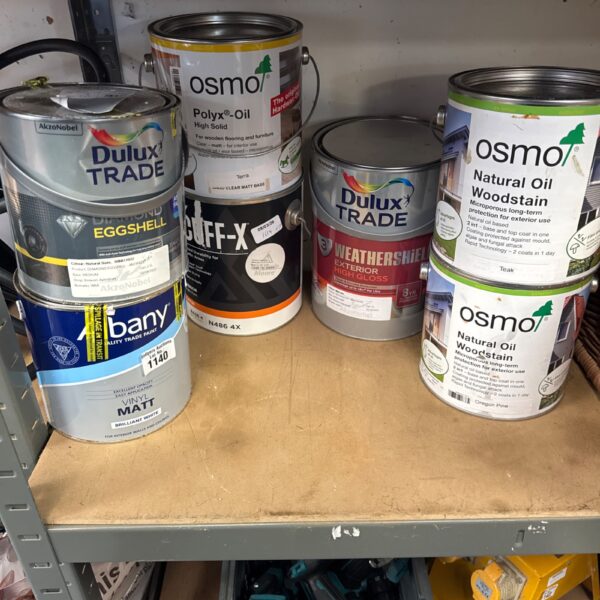 Assorted paint tins including Osmo woodstain for DIY projects.