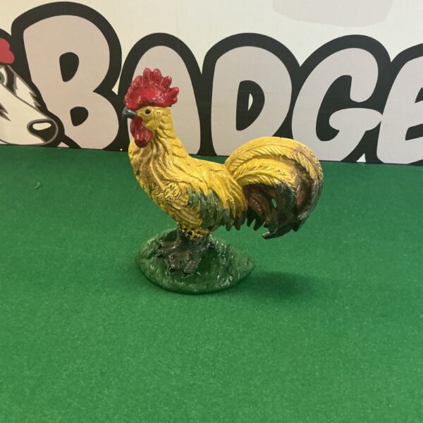 Vintage cast iron cockerel doorstop for farmhouse decor.