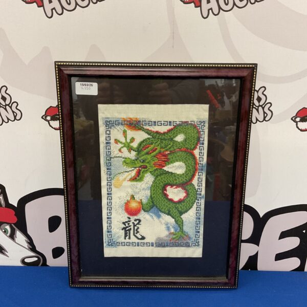 Framed vintage Chinese dragon embroidery, detailed silk artwork.