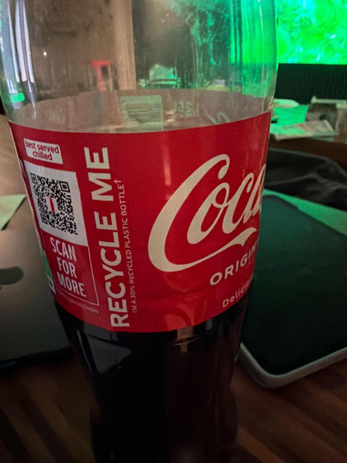 Recycled plastic Coca-Cola bottle with classic branding.
