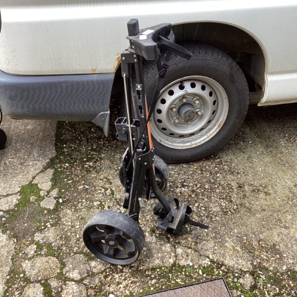 Used Drytona golf trolley with folding design for easy transport.