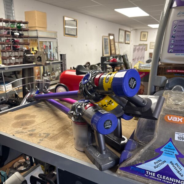 Front view of a Dyson V8 cordless vacuum cleaner.