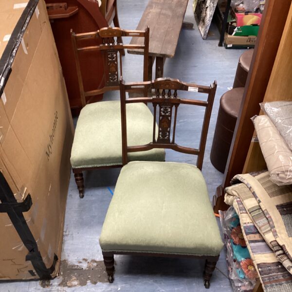 Pair of antique Edwardian inlaid nursing chairs on costers.
