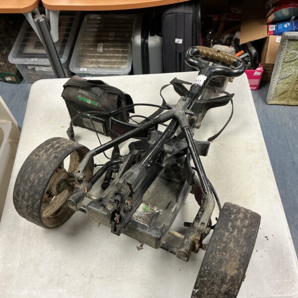Side view of an electric golf caddy with three wheels.