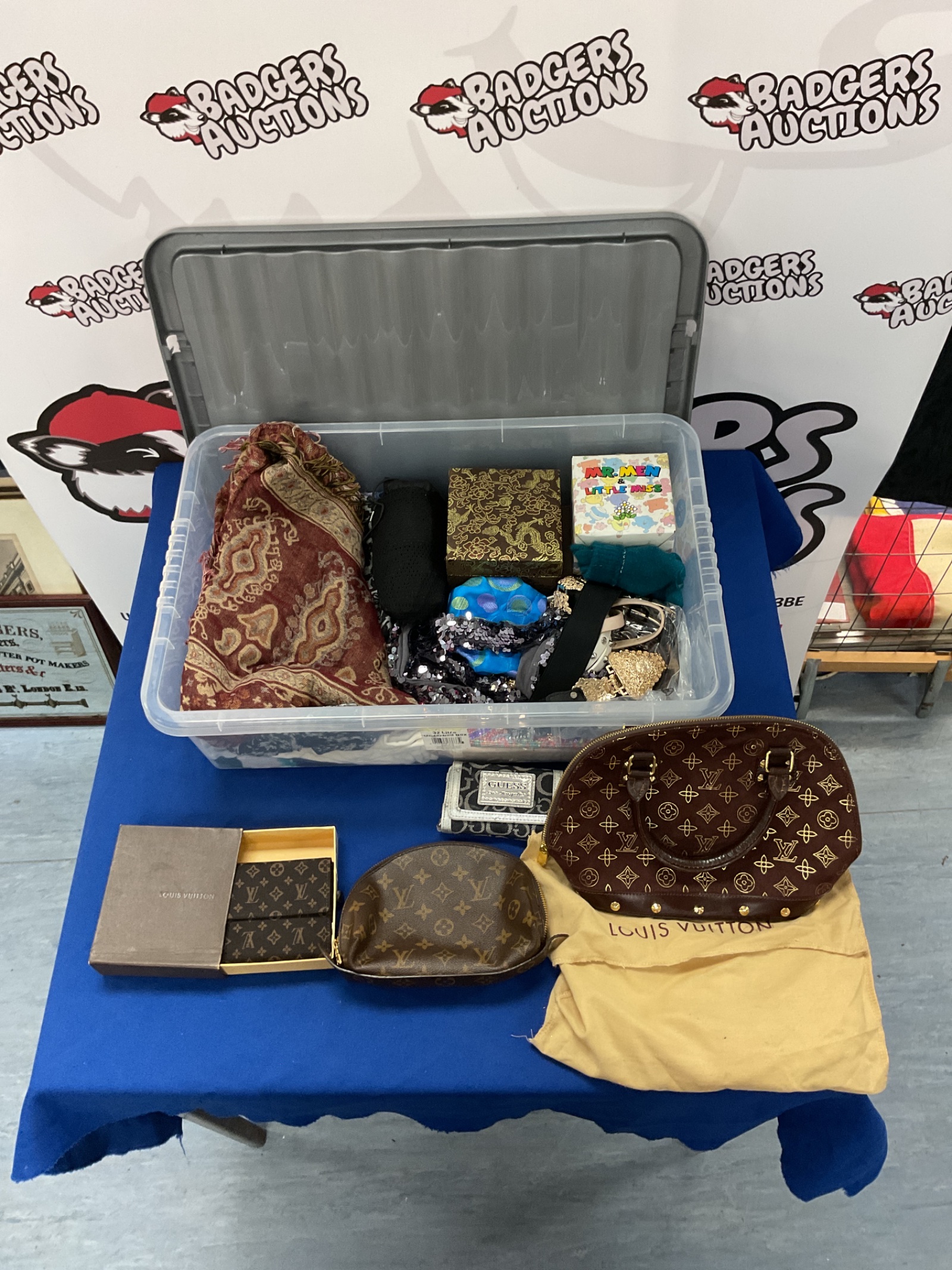493 Box containing some tapestries, Louis Vuitton style wallet and bags and other fashion items