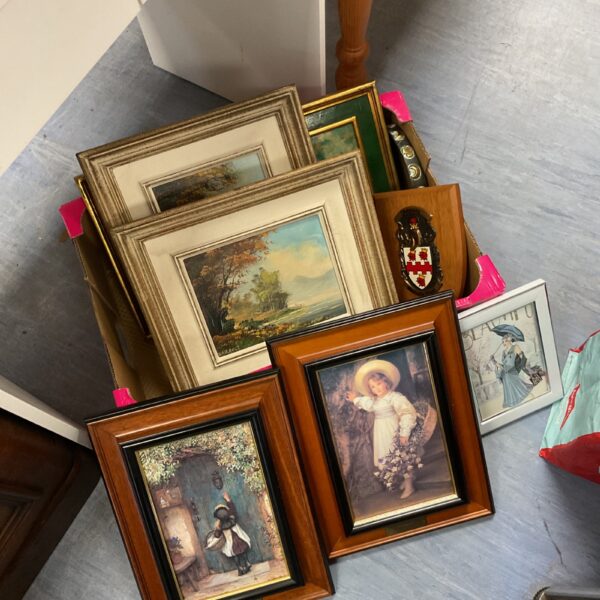 Collection of vintage framed oil paintings and prints for wall decor.