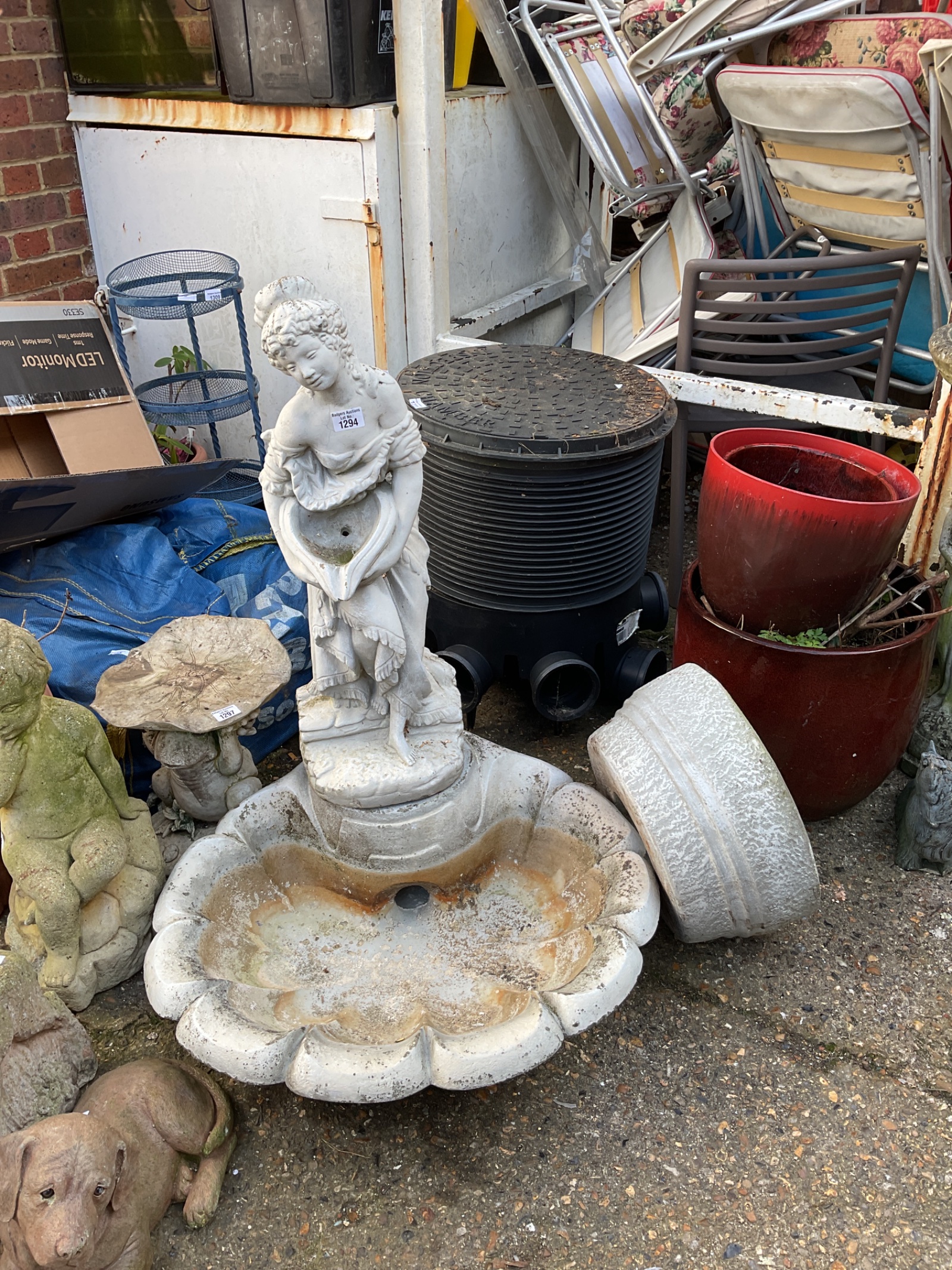 1294 Cast stone maiden on clamshell garden water feature