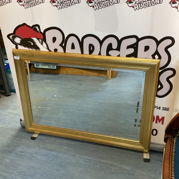 Elegant gilt framed bevel edged mirror for wall decoration.