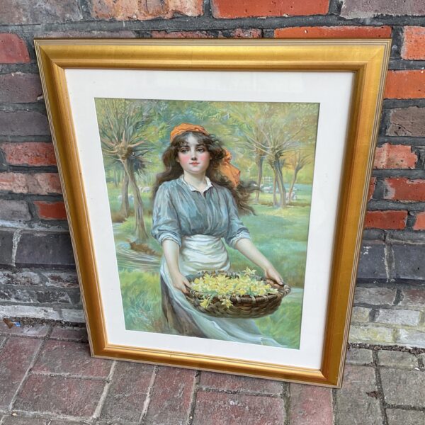 Large gilt framed floral print of a young woman with flowers.