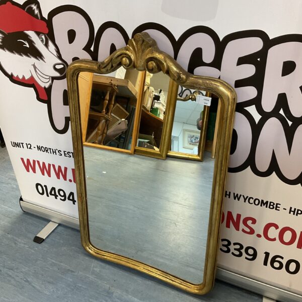 Antique gilt hall mirror with ornate frame.
