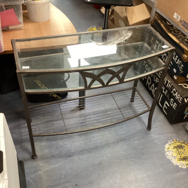 Modern hall table with metal frame and glass top.