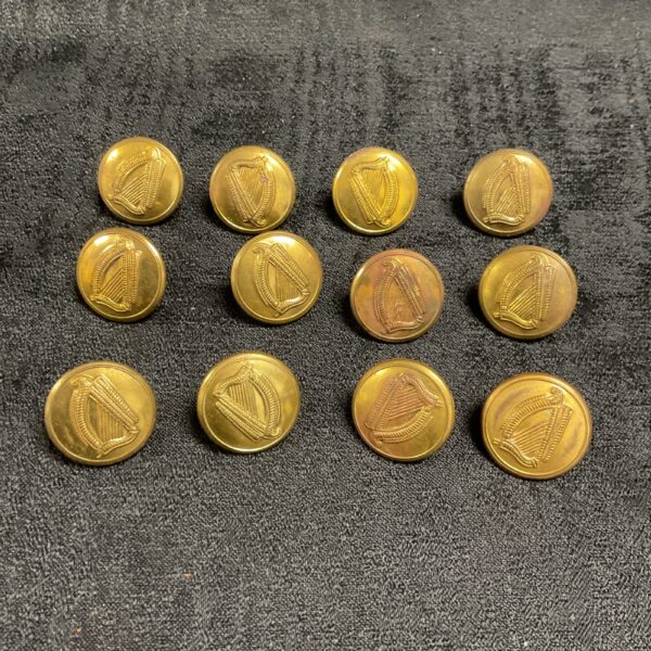 Set of twelve antique Irish Volunteers harp brass buttons.