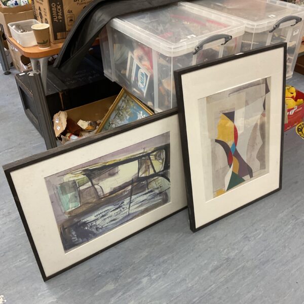 Two framed modern art prints with abstract designs.