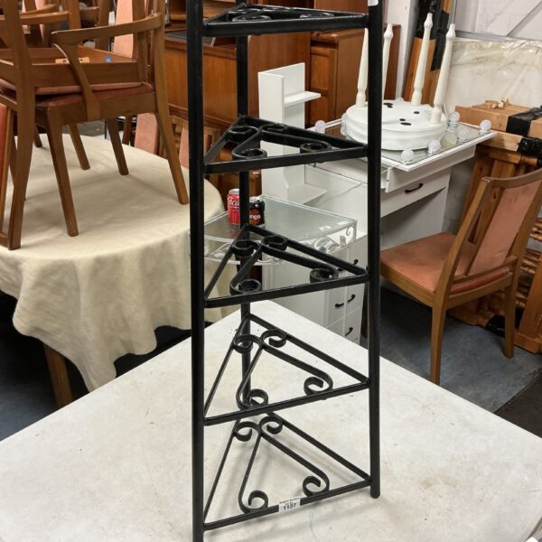 Metal five-tier kitchen pot rack for cookware organization.