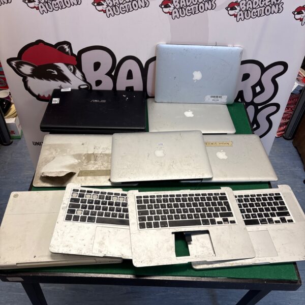 A collection of used laptops for spares and repair.