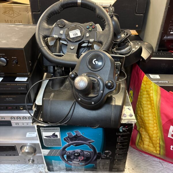 Logitech G920 racing wheel set for immersive PlayStation gaming.