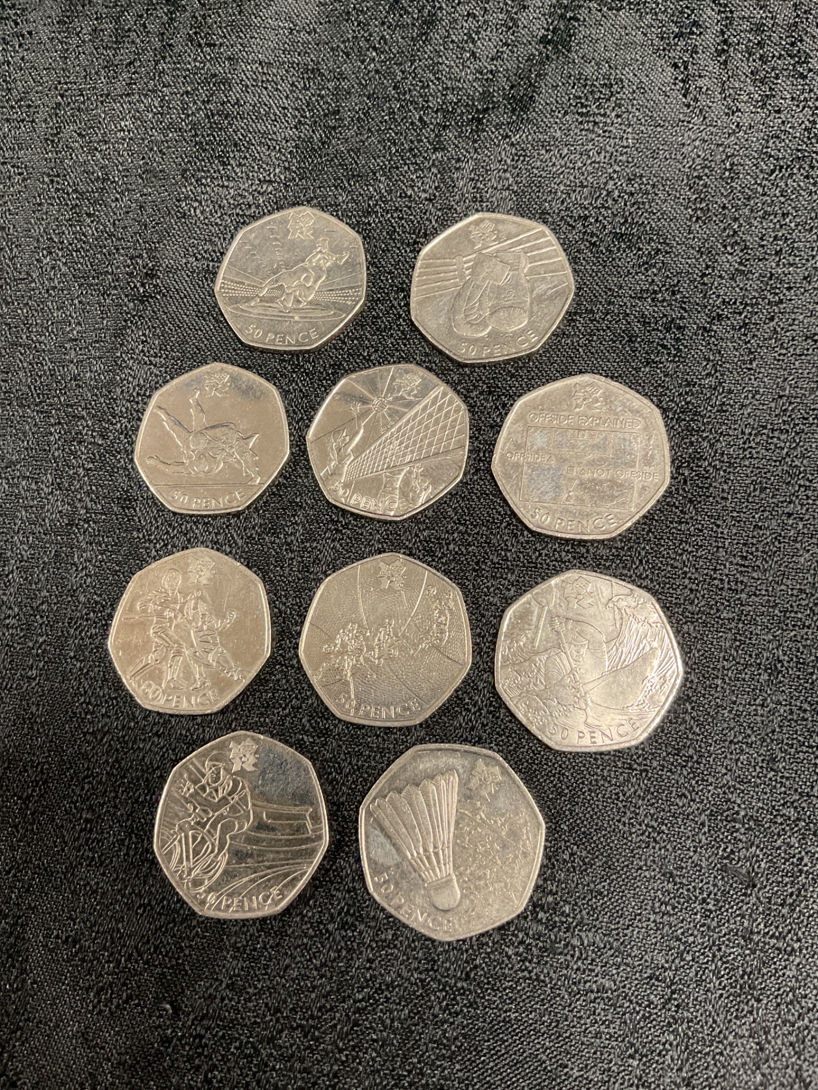 895 Ten 2011 London olympics 50pence coins inc offside rule canoeing and boxing