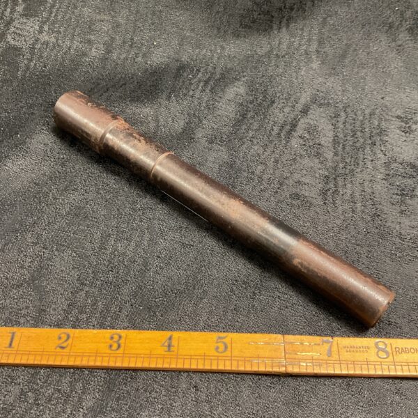 Vintage M45 telescope side view, showing wear and markings.