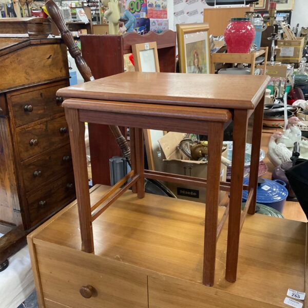 Vintage mid-century nest of tables in warm wood tone.