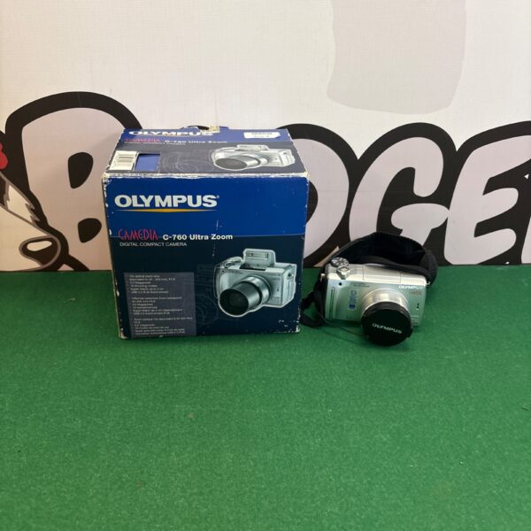 Olympus Camedia C-760 camera in its original box with cables.