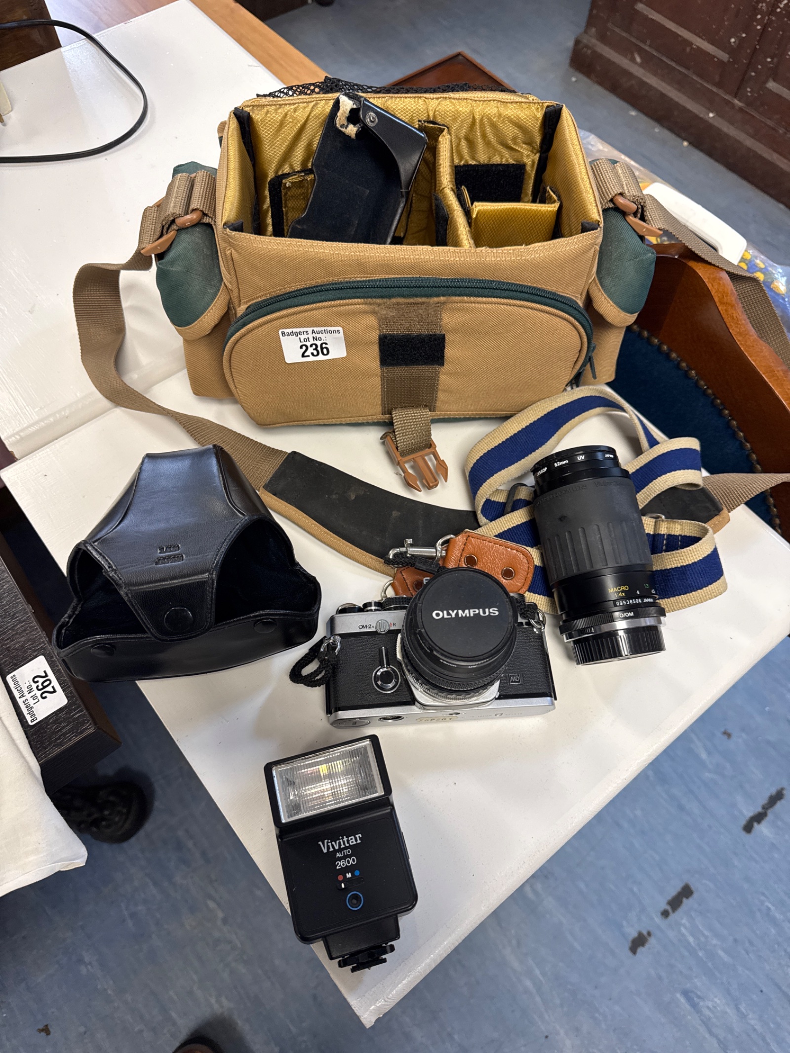 236 Olympus om-2n camera with Vivitar flash unit & vivitar 52mm lens with carry bag
