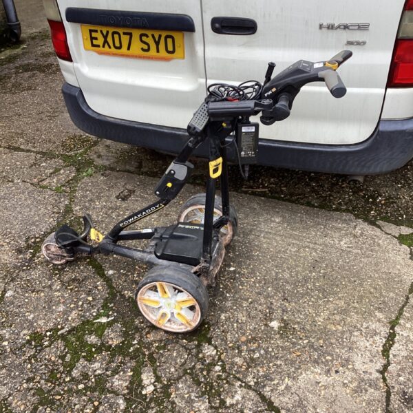 Motorised Powakaddy golf trolley on a course.