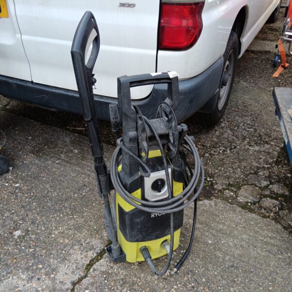 Front view of a used Ryobi pressure washer for garden cleaning.