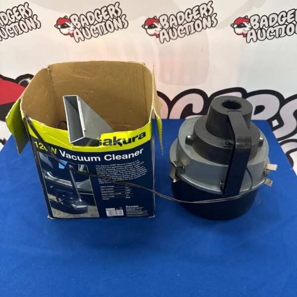 Sakura 120w car vacuum in its original box.