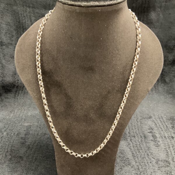 Close-up of a silver chunky link necklace on a display.