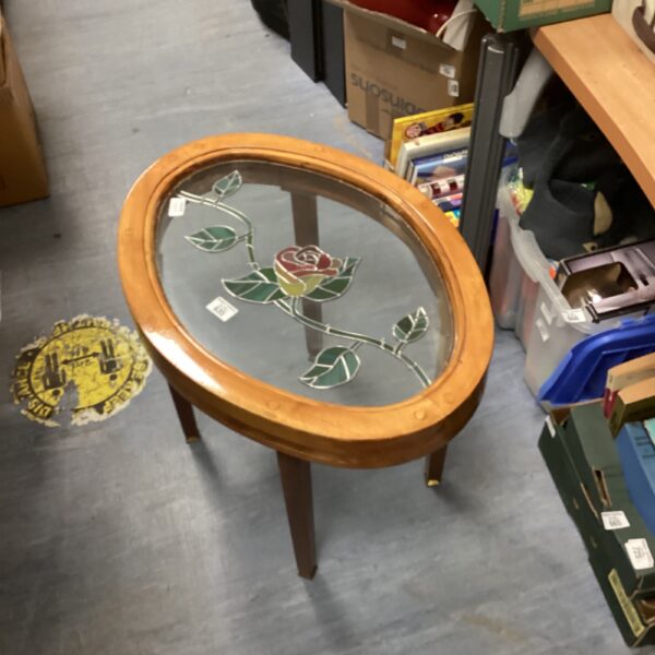 Vintage stained glass table with floral design.