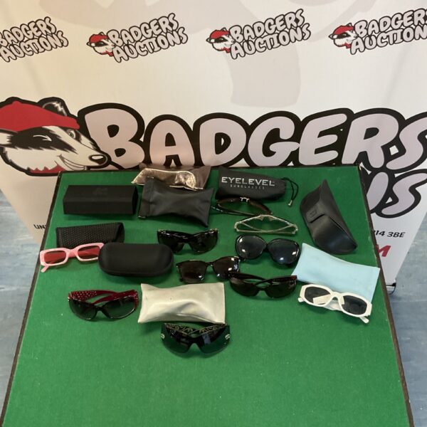 Collection of sunglasses and cases presented as a lot.