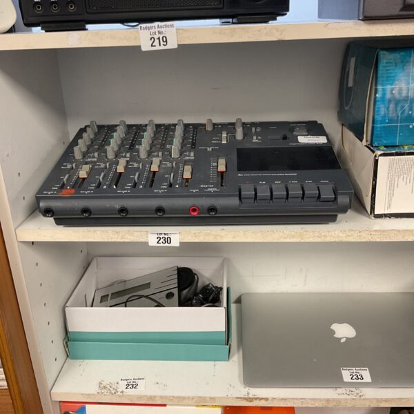 Front view of a vintage Tascam Portastudio 414 cassette recorder.