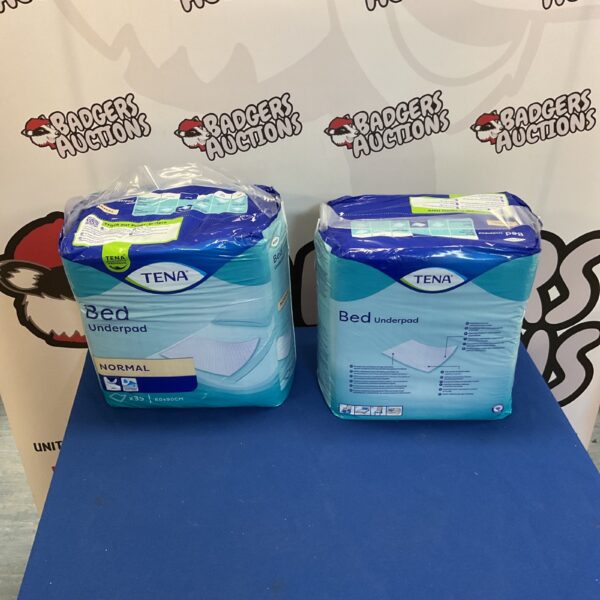Sealed packs of Tena Bed Underpads for incontinence protection.