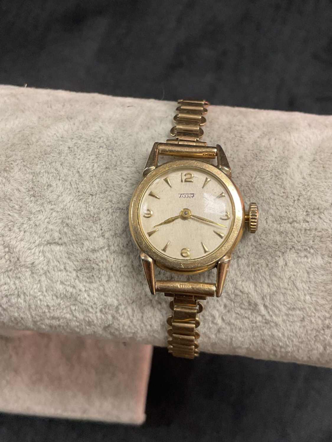 Vintage Tissot ladies watch with gold strap and dial.