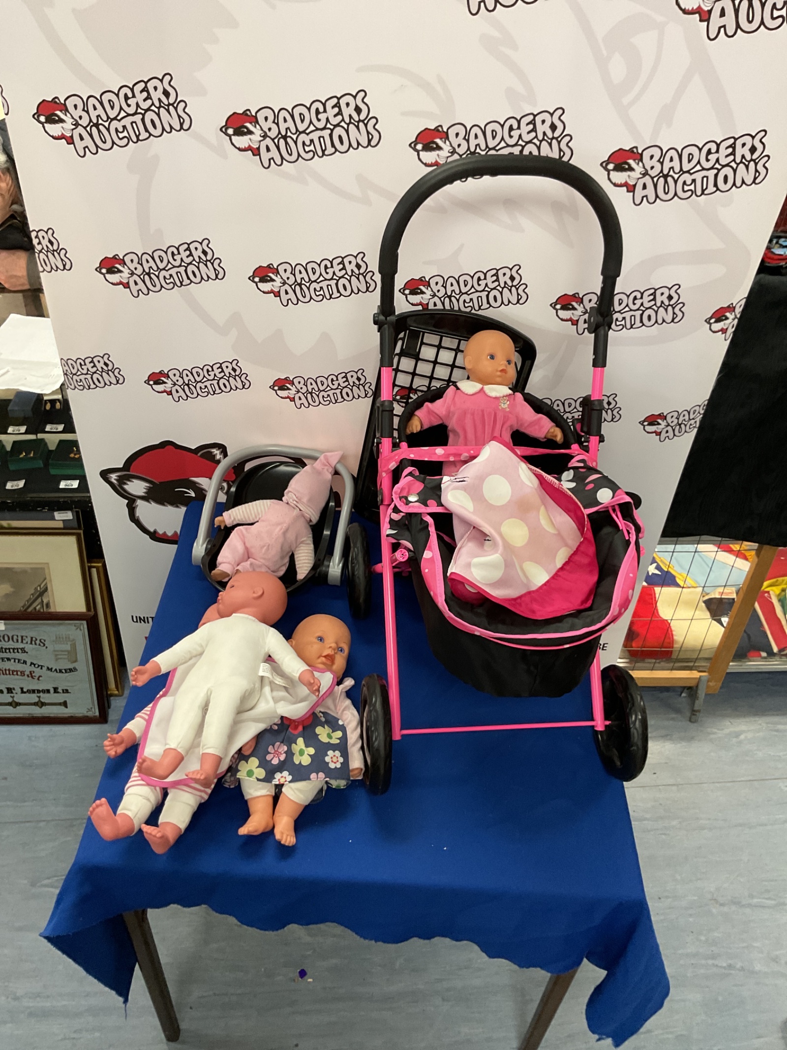 418 Childrens toy baby pram with number of baby dolls