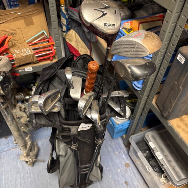 Vintage golf clubs with Mizuno T Zoid irons in a bag.