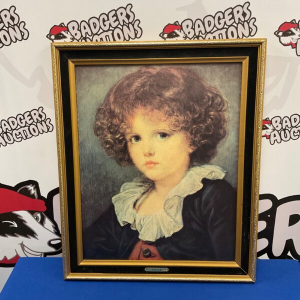 Vintage greuze print of a young girl in a decorative frame.