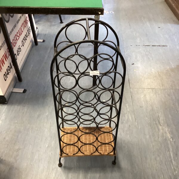 Vintage metal floor standing wine rack for wine storage.
