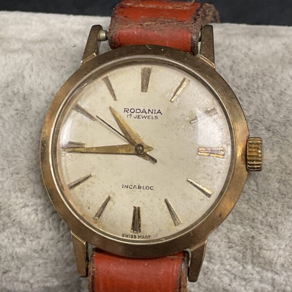 Vintage Rodania watch with cream dial and gold markers.
