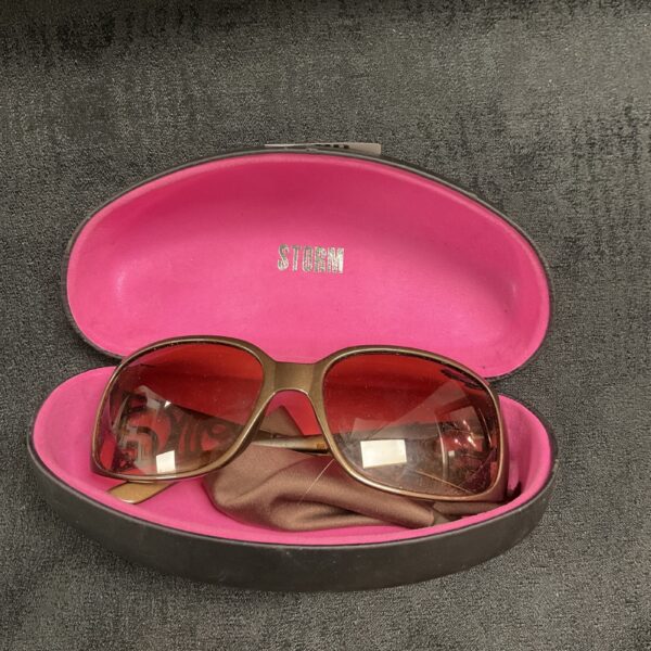 Front view of vintage Storm sunglasses with a distinctive frame.